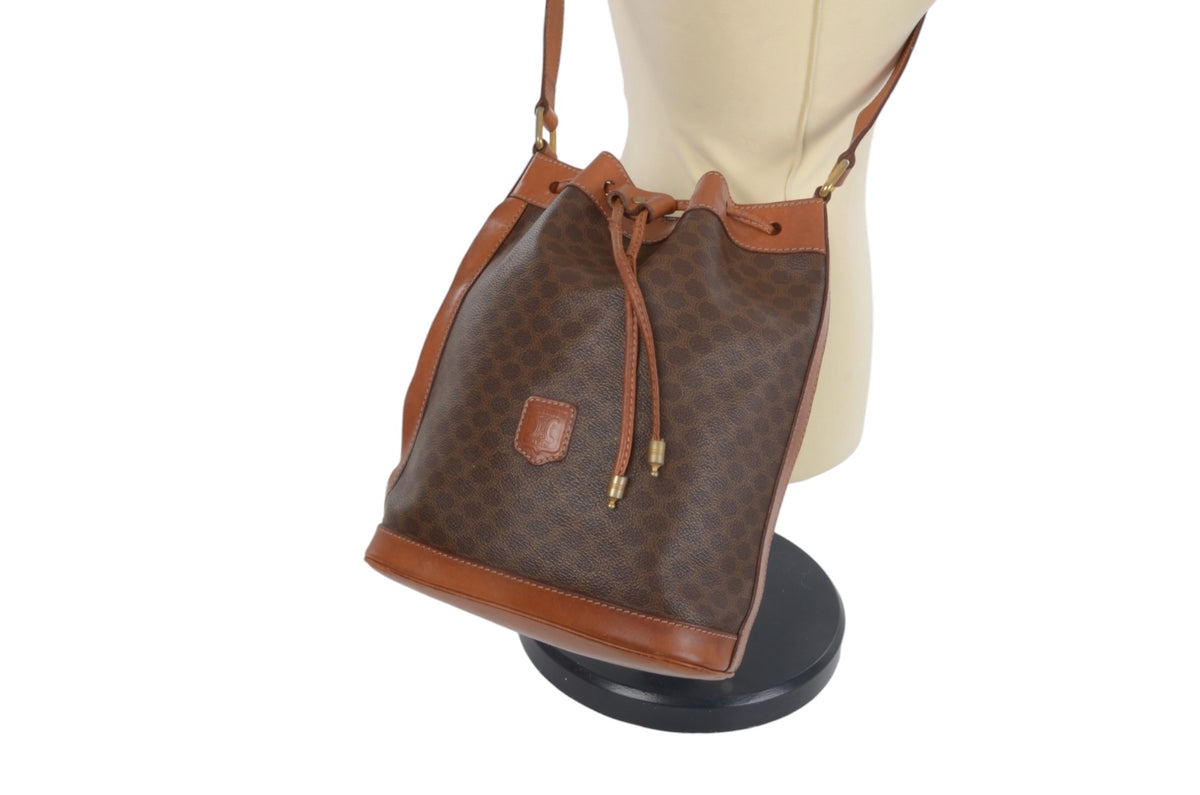 Celine Triomphe vintage drawstring shoulder bag showing side profile and bucket shape
