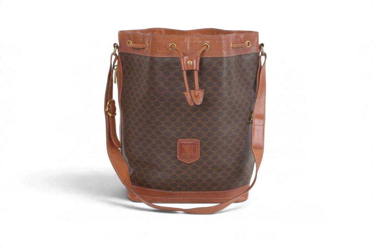 Celine Triomphe drawstring bucket bag side view with exterior pocket