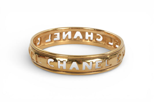 Chanel Gold Plated Cut Out Logo Bangle Bracelet 1980's Vintage Cuff Designer Classic